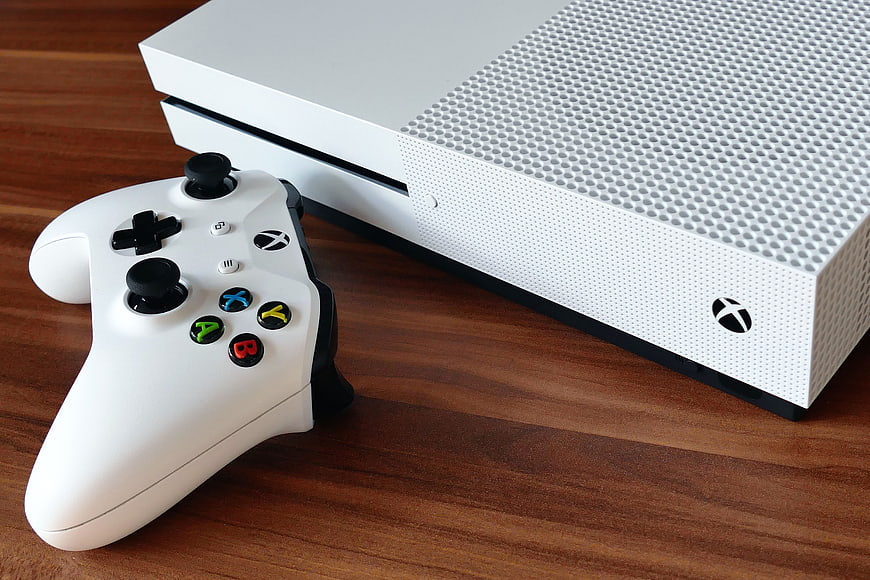 White Xbox Series S Console and Controller on Wooden Table