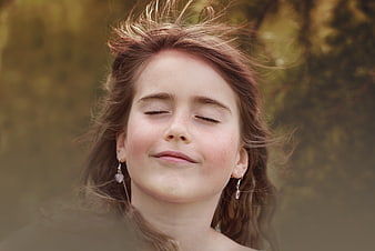 Serene Portrait of Girl with Closed Eyes in Nature