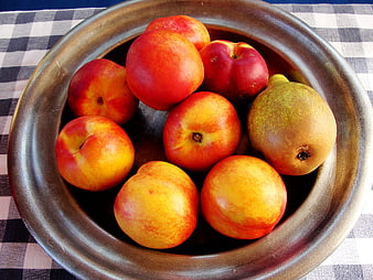 Fresh Nectarines and Pear in Rustic Ceramic Bowl