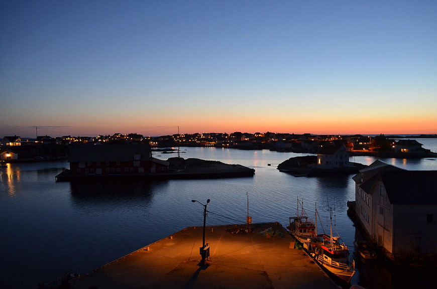 Coastal Fishing Village Harbor at Sunset with Boats