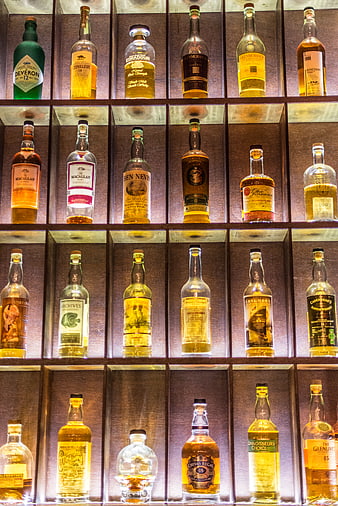 Illuminated Shelves of Premium Whiskey Bottles