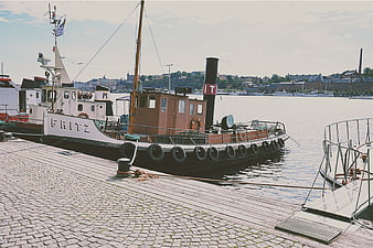Vintage Steamboat Fritz Docked at Cobblestone Harbor