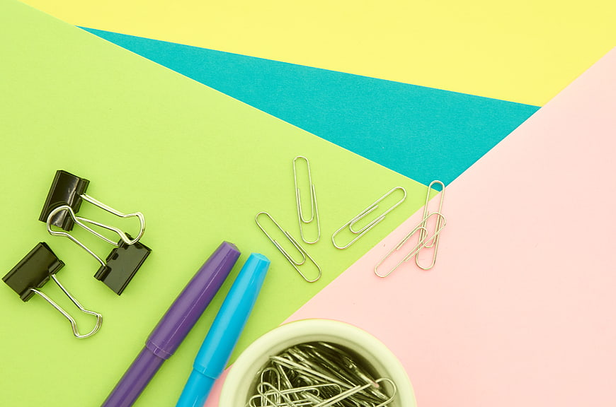 Colorful Office Supplies Flat Lay on Geometric Background