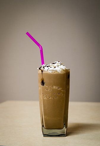 Iced Coffee Frappe with Whipped Cream and Pink Straw