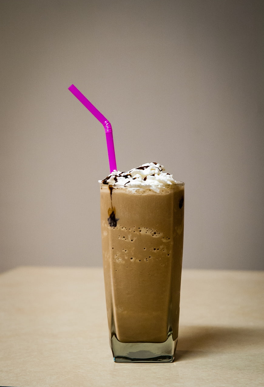 Iced Coffee Frappe with Whipped Cream and Pink Straw