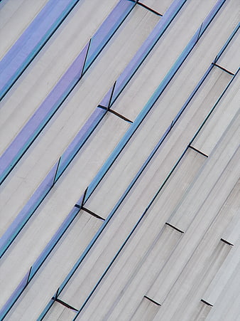 Abstract diagonal architectural pattern with blue and white stripes