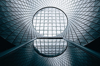 Modern Glass Architecture with Geometric Patterns and Reflections