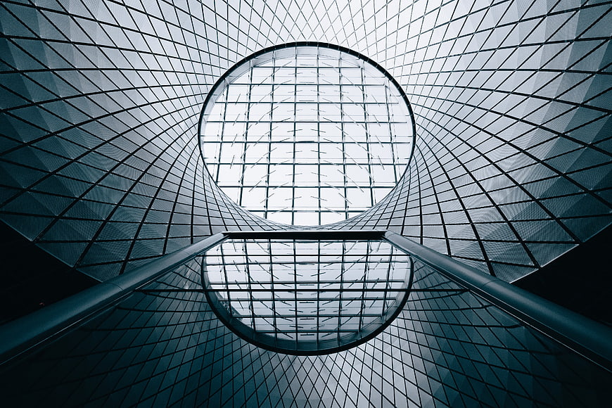 Modern Glass Architecture with Geometric Patterns and Reflections
