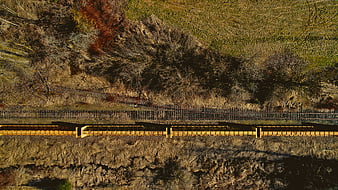 Aerial View of Yellow Freight Train on Tracks
