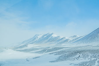Snowy Mountain Landscape in Iceland with Blue Sky