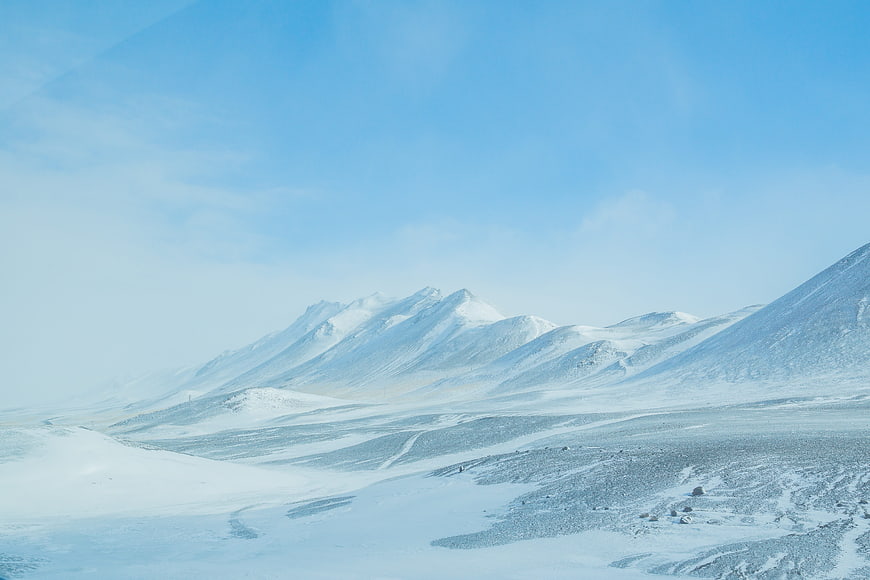 Snowy Mountain Landscape in Iceland with Blue Sky