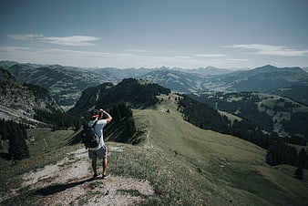 Hiker Taking Photo of Mountain Landscape