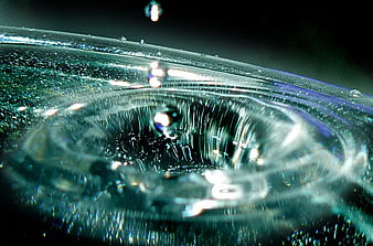 Macro photography of water droplet impact ripples