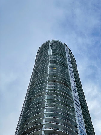 Low Angle View of Curved Modern Skyscraper