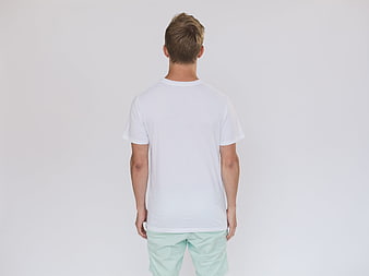 Back view of man in white t-shirt and mint shorts