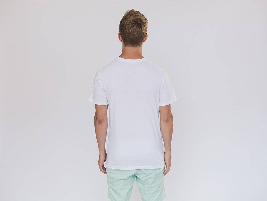 Back view of man in white t-shirt and mint shorts