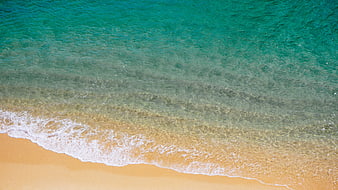 Aerial View of Turquoise Ocean Waves Washing on Sandy Beach