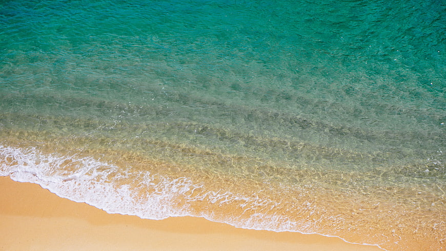 Aerial View of Turquoise Ocean Waves Washing on Sandy Beach