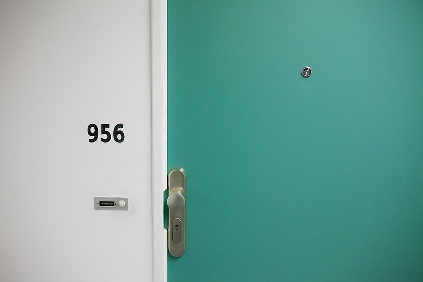 Teal Apartment Door with Number 956 and Silver Handle
