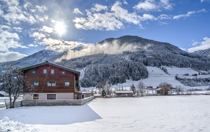 Snowy Alpine Chalet with Mountain View