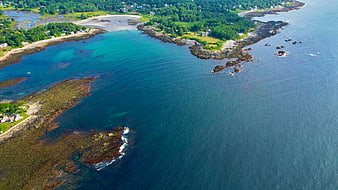 Aerial View of Rocky Coastal Shoreline with Turquoise Water
