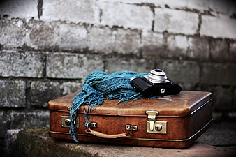 Vintage Leather Suitcase with Retro Camera and Blue Scarf