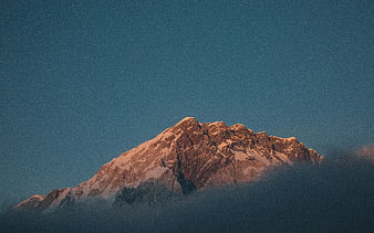 Snow-Capped Mountain Peak at Golden Hour