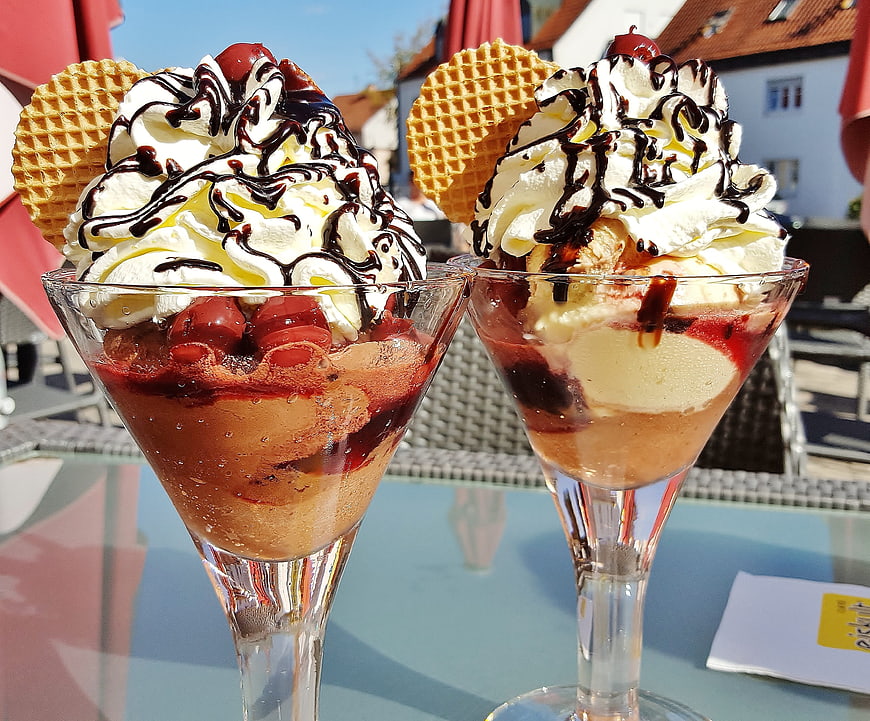Two Gourmet Ice Cream Sundaes with Whipped Cream and Waffles
