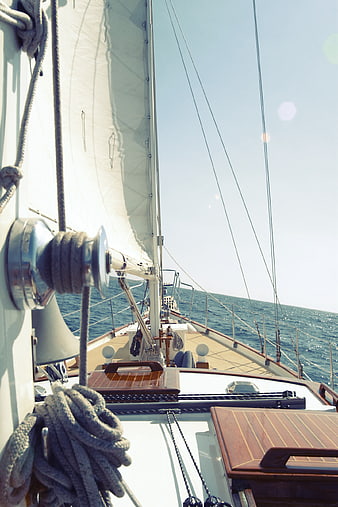 Sailboat Deck View with Ropes and Ocean Horizon