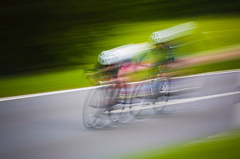 Motion blur of cyclists racing on a road