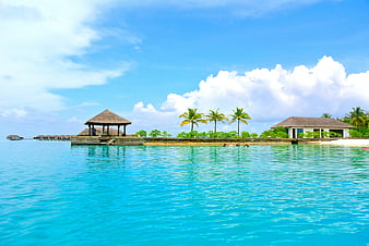 Tropical Maldives Resort with Overwater Bungalows and Turquoise Ocean