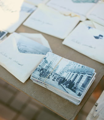 Vintage Postcards and Envelopes on Wooden Table