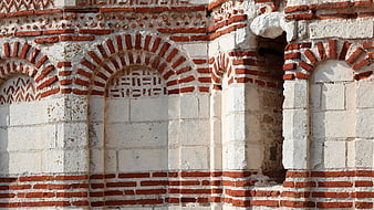 Byzantine brick and stone church wall detail in Nesebar, Bulgaria