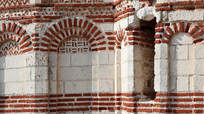 Byzantine brick and stone church wall detail in Nesebar, Bulgaria