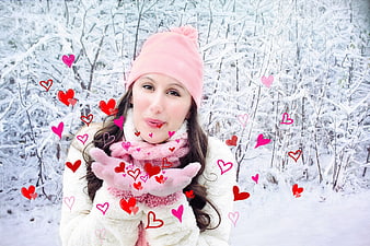 Woman in Pink Winter Clothes Blowing Kisses with Hearts