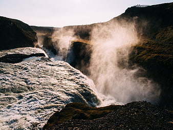 Majestic Gullfoss Waterfall in Iceland with Mist and Sunlight