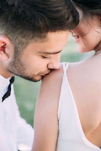 Close-up of romantic couple embracing outdoors