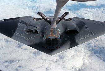 B-2 Spirit Stealth Bomber Mid-Air Refueling Above Clouds