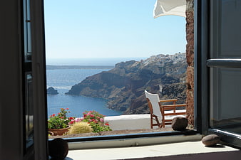 Santorini View Through Window with Sea and Cliffside Village