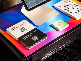 Colorful Business Cards and Stickers on Vibrant Market Booth Table