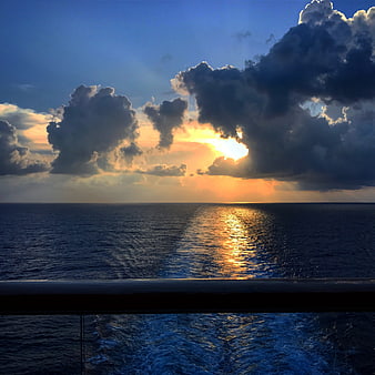 Dramatic Sunset Over Ocean Viewed From Cruise Ship Deck