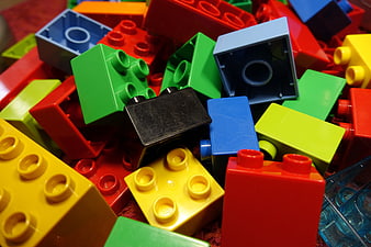 Close-up of colorful plastic building blocks scattered in a pile