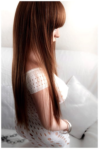 Side Profile of Woman with Long Brown Hair in White Dress