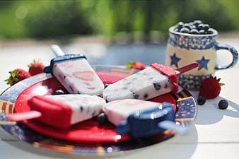 Patriotic red white and blue popsicles on a plate
