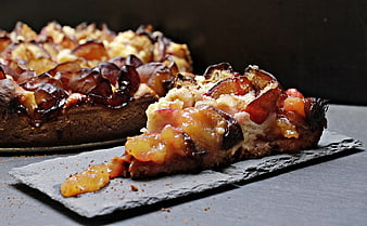 Rustic Plum Streusel Cake Slice on Slate Board