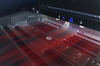 Close-up of digital printing press with red laser scanning lines