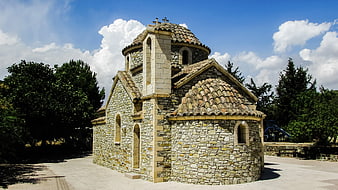 Traditional Stone Church with Dome and Blue Sky