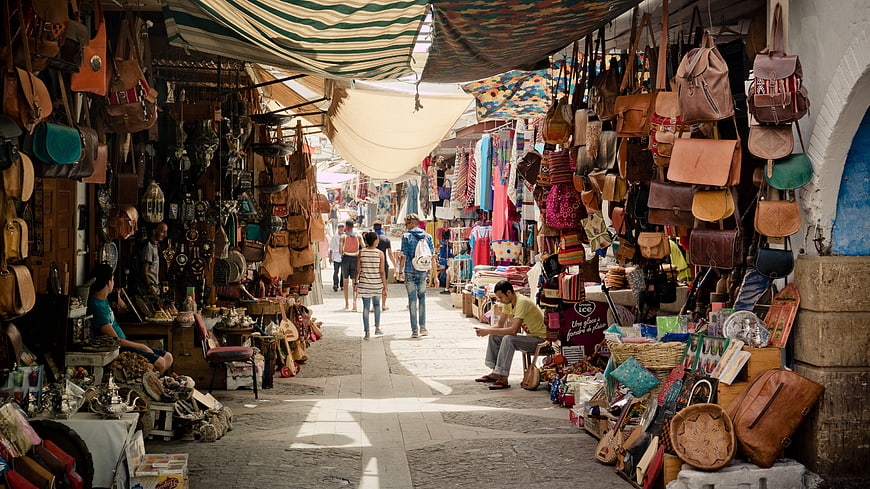 Busy Moroccan Souk Alley with Leather Goods and Souvenirs
