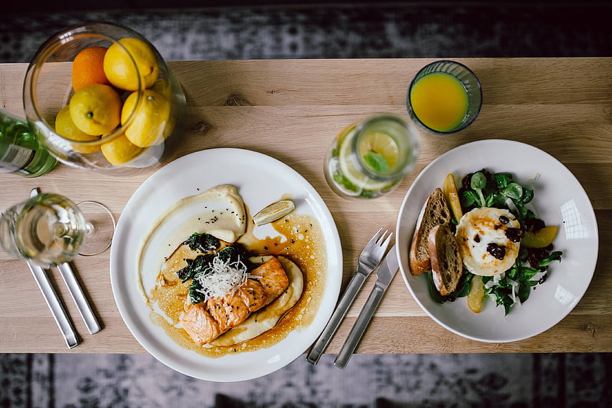 Top View of Healthy Salmon Dinner with Salad and Juice