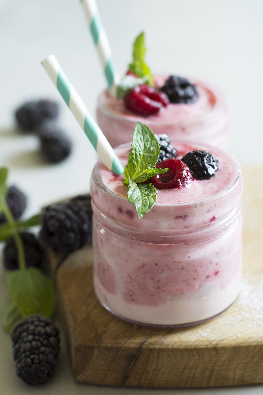 Fresh Berry Smoothie in Glass Jars with Mint Garnish